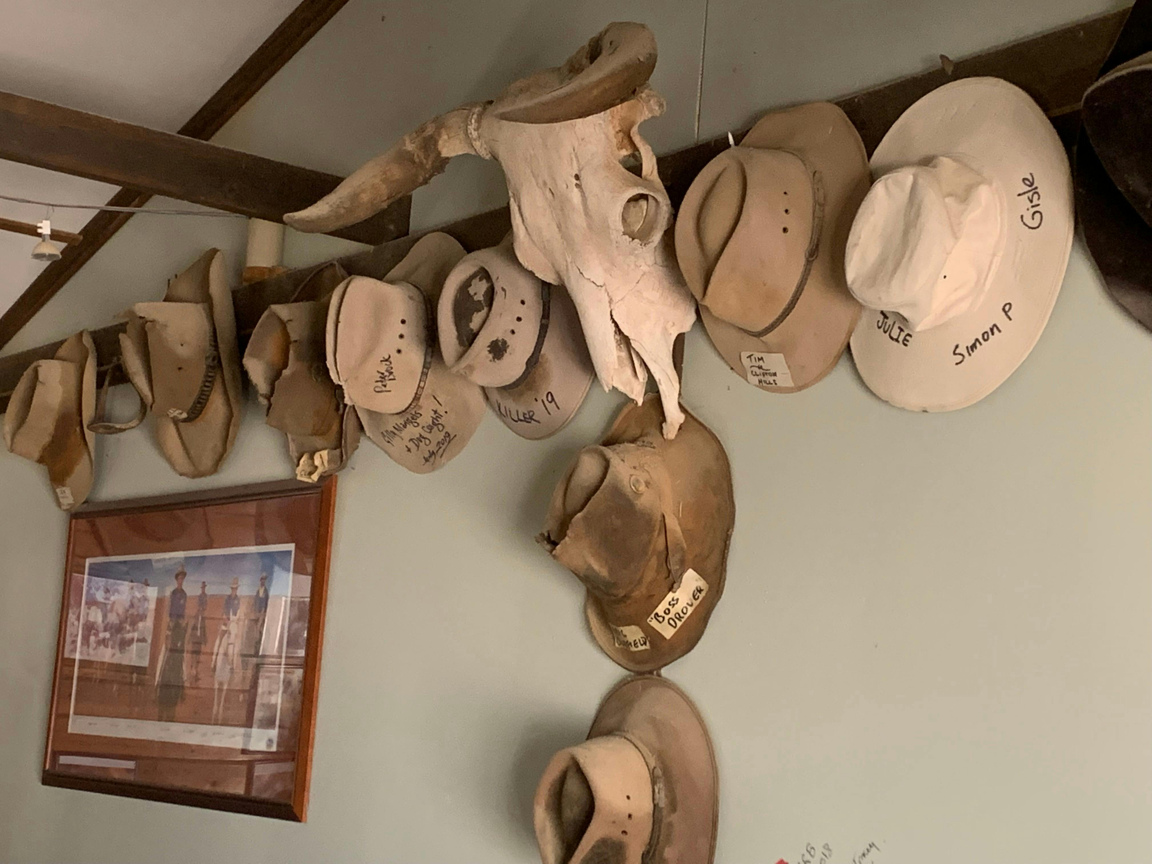 Cowboys hats adorning a pub wall