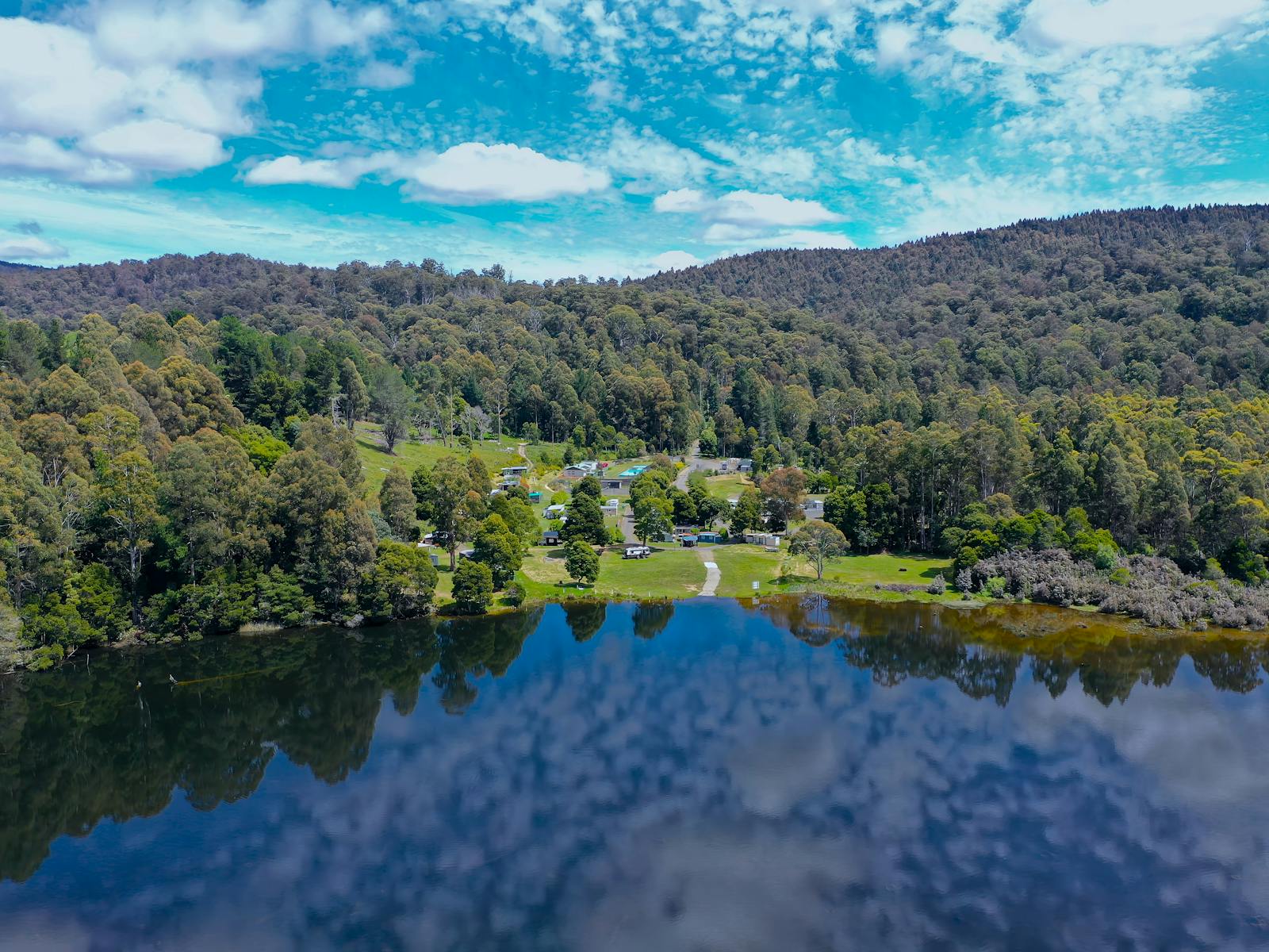 Drone shot of park from the lake