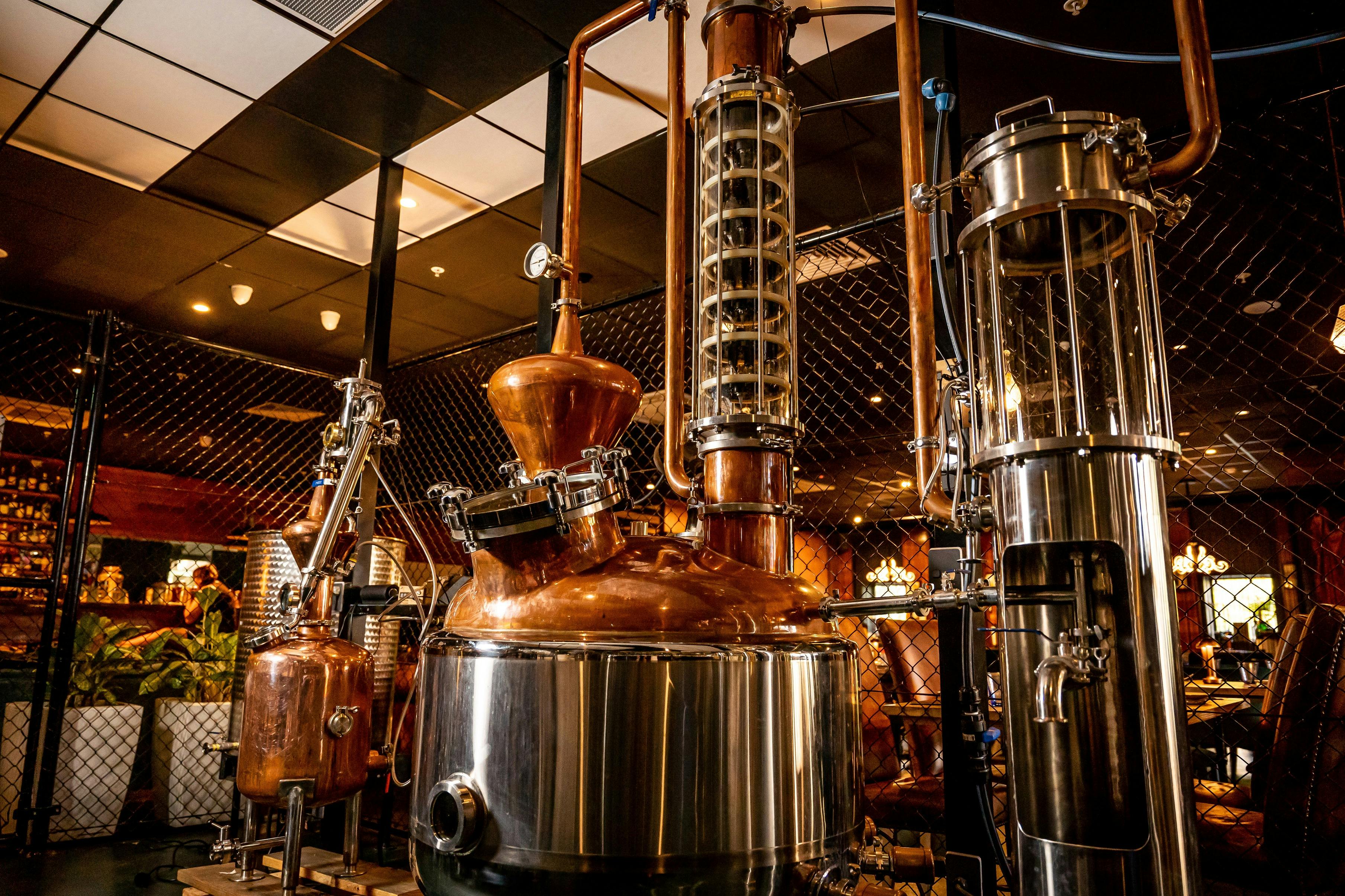 The copper distiller inside Charlie's of Darwin