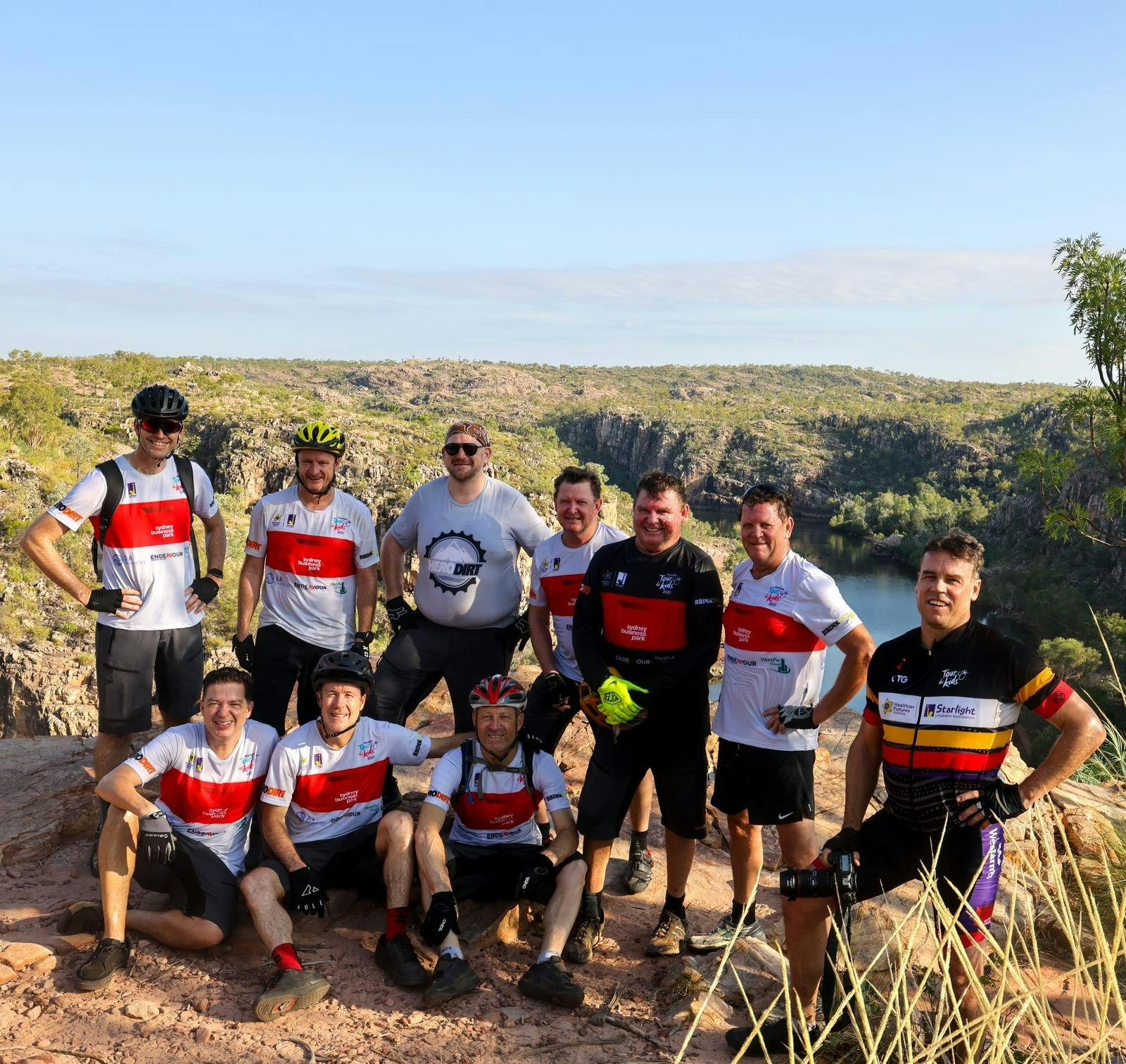 Riders posing at the top of Nitmiluk Gorge after riding trails.