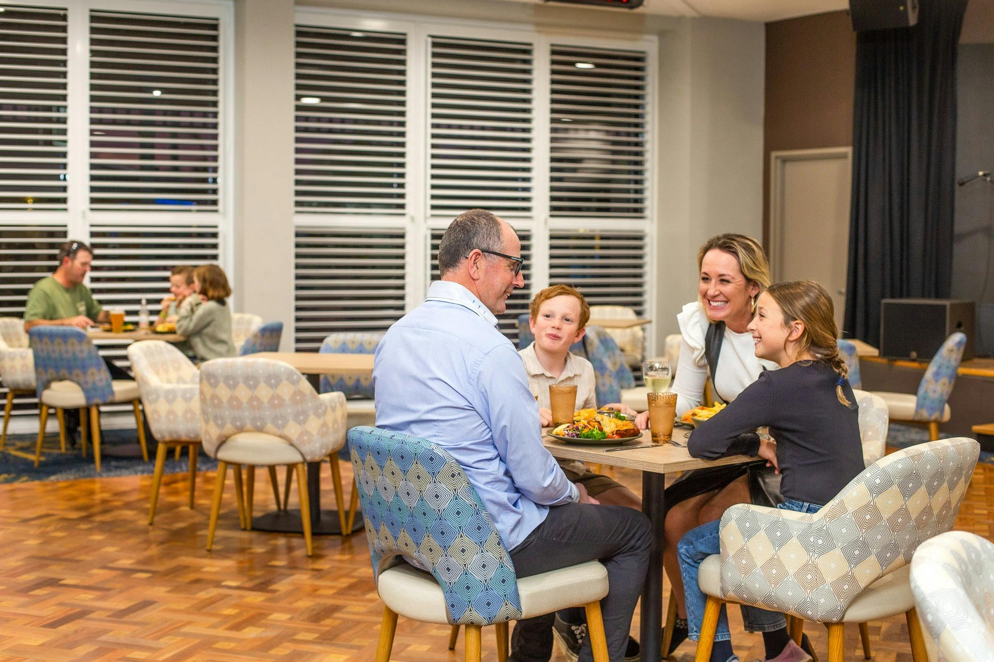 Family enjoying dinner at the Bistro