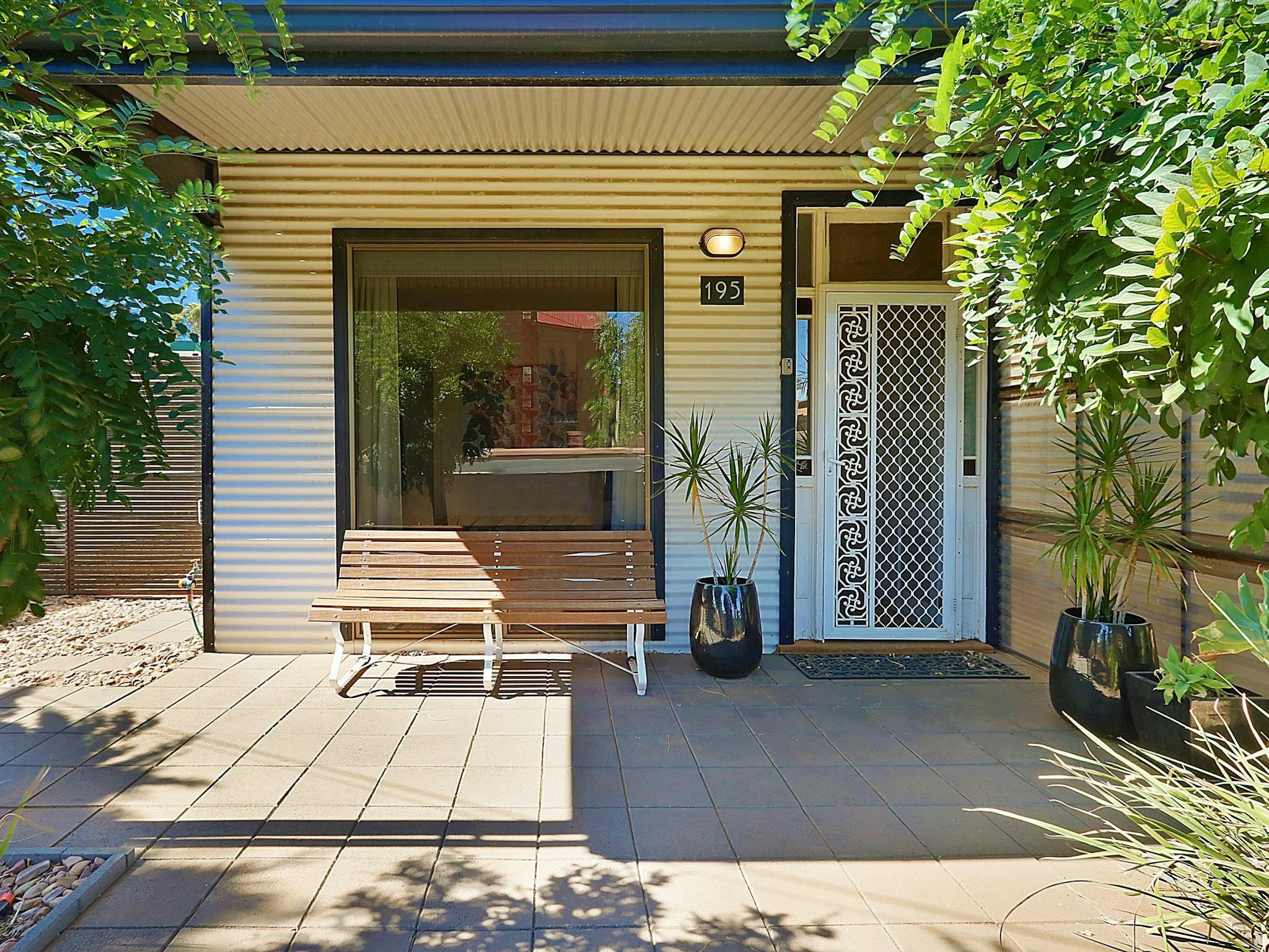 Generously shaded front of the house, ensures privacy and a leafy outlook