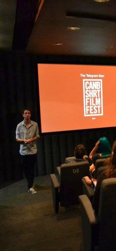 Movie Screen showing CSFF logo with audience watching