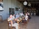 group tasting wine and coffee around a long table