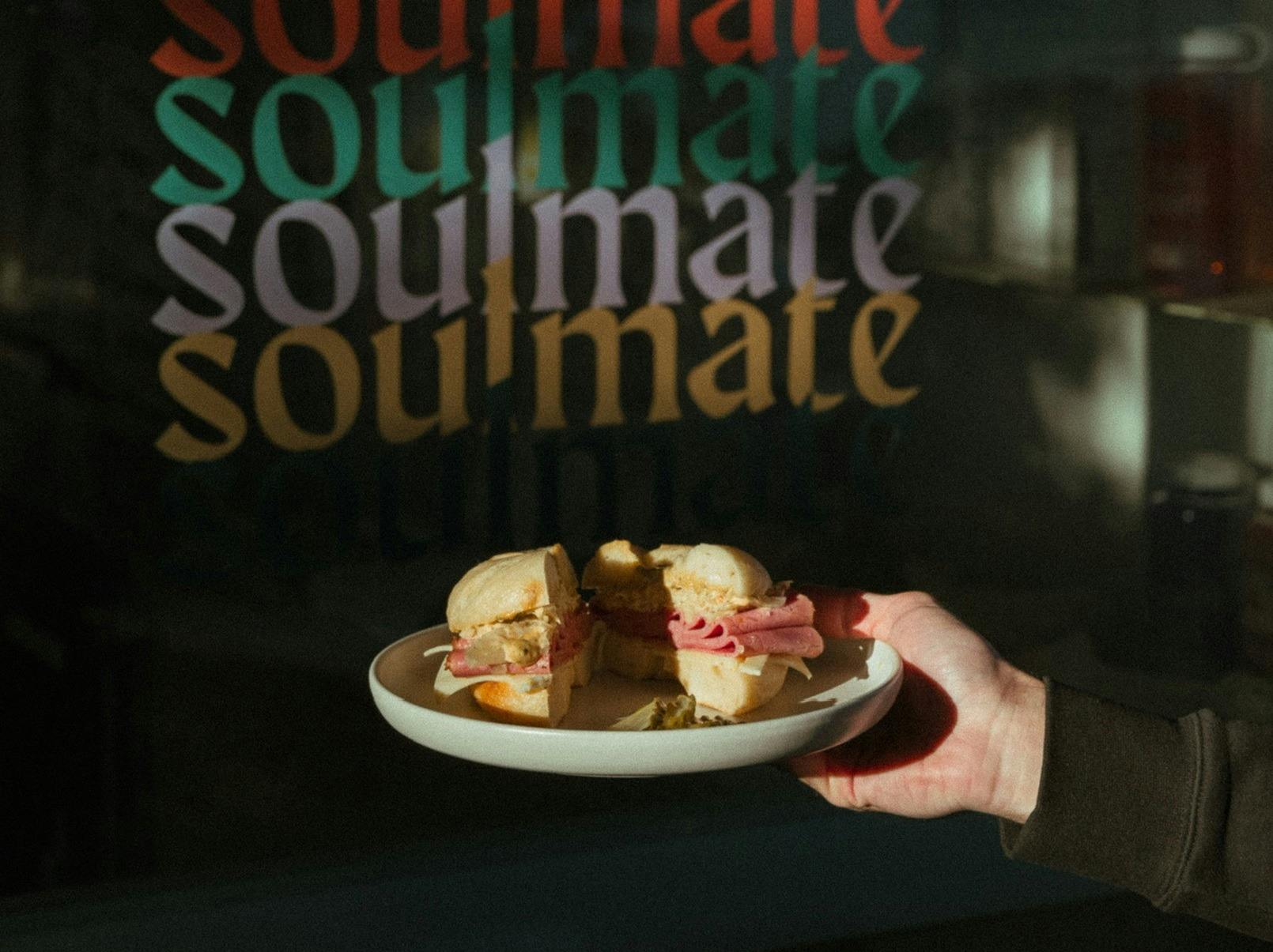 Soulmate - hand holding bagel at Soulmate
