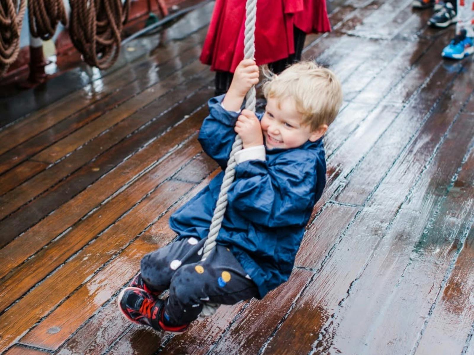 Polly Woodside Pirate Day kid swinging on rope