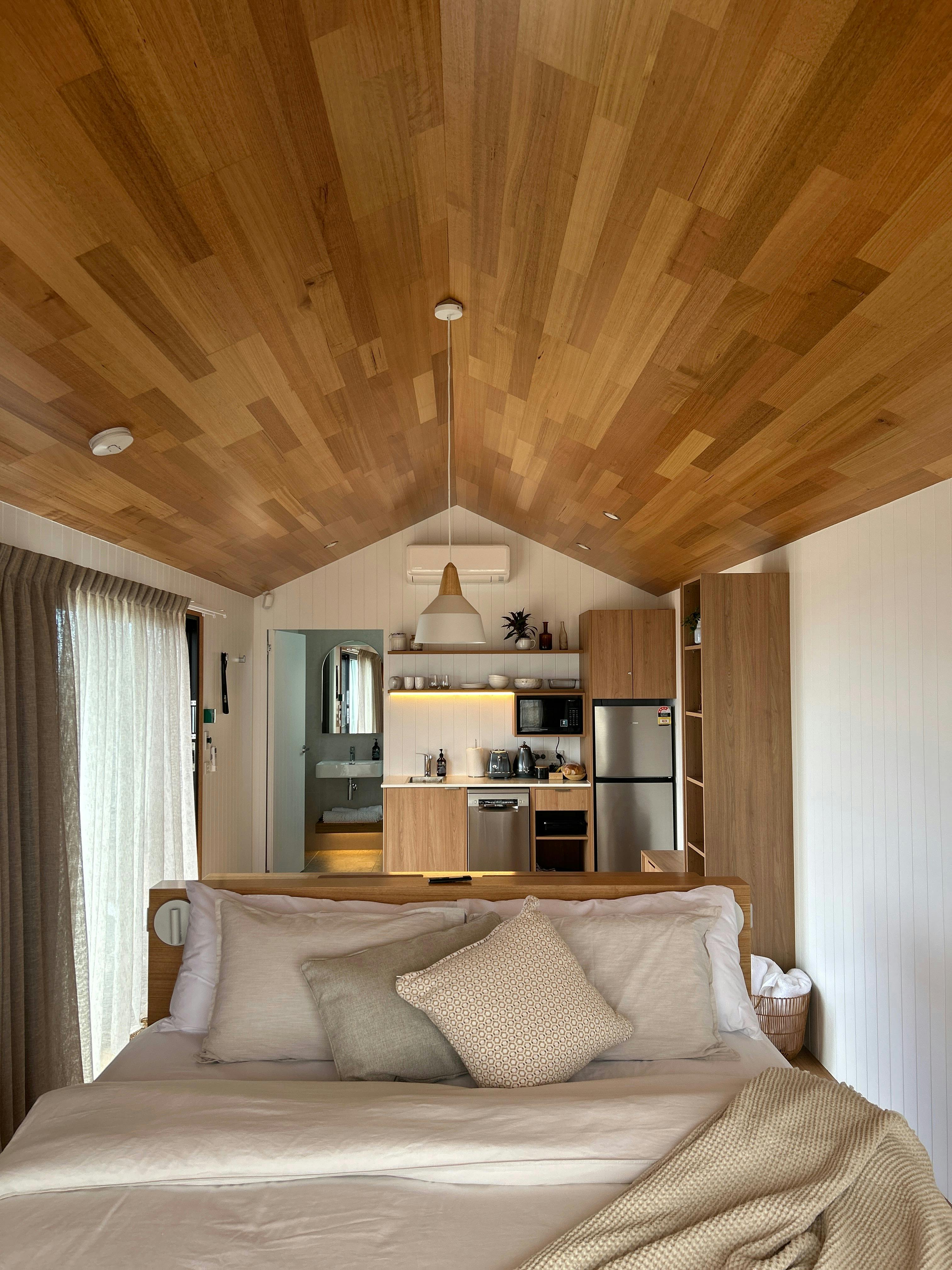 Pod interiors with Tasmanian oak, a cosy calm escape ✨