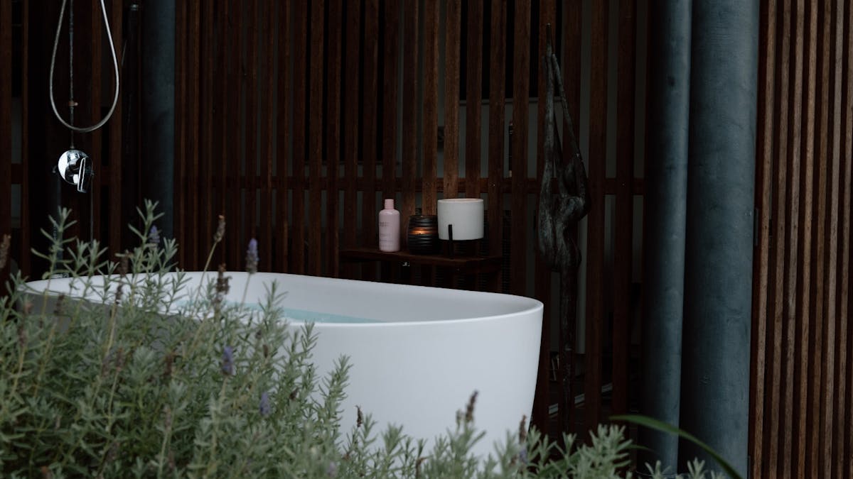 Outdoor bathtub and shower on downstairs balcony