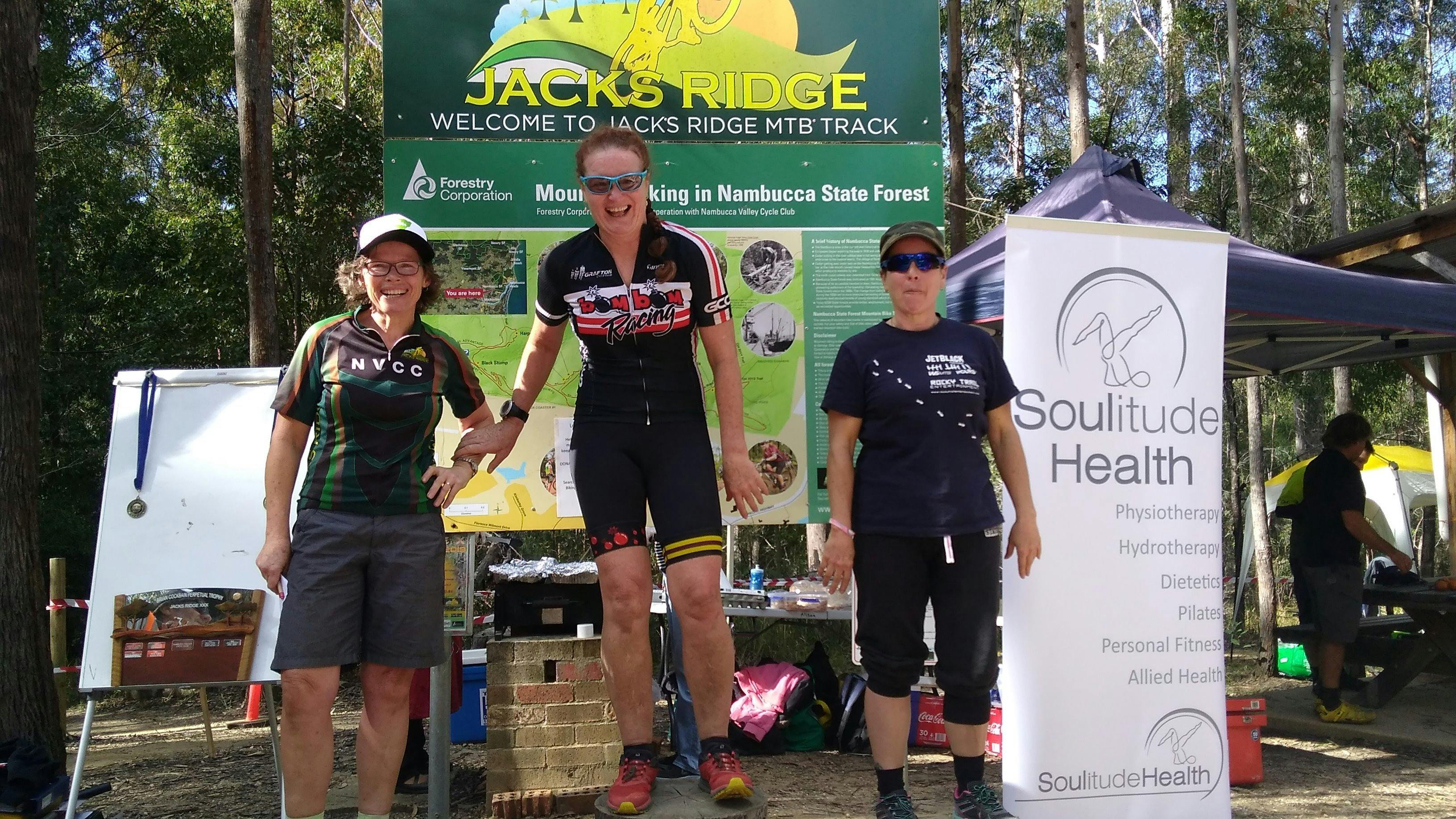 Three women on the podium at Jacks Ridge after competing in the Jills