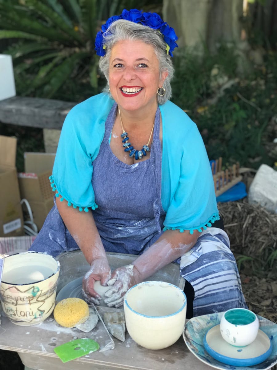 Photo shows Zeynep Testoni making a bowl on the pottery wheel