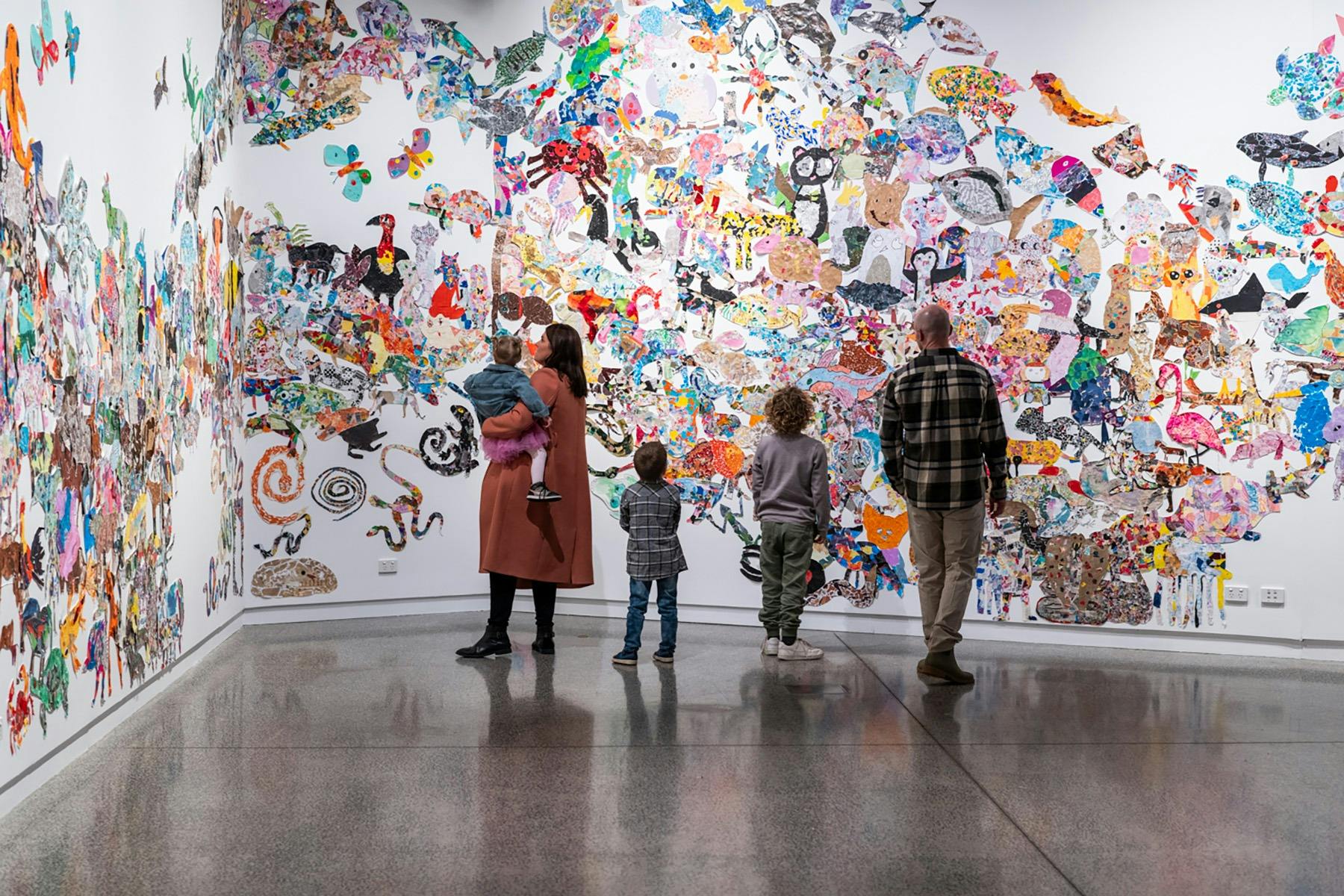 A family looks at the past exhibition 'Animal Kin'