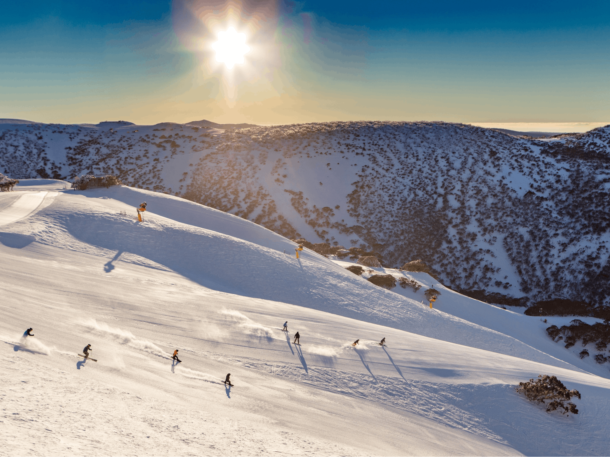 Aerial view of skiers and snowboarders at Mt Hotham
