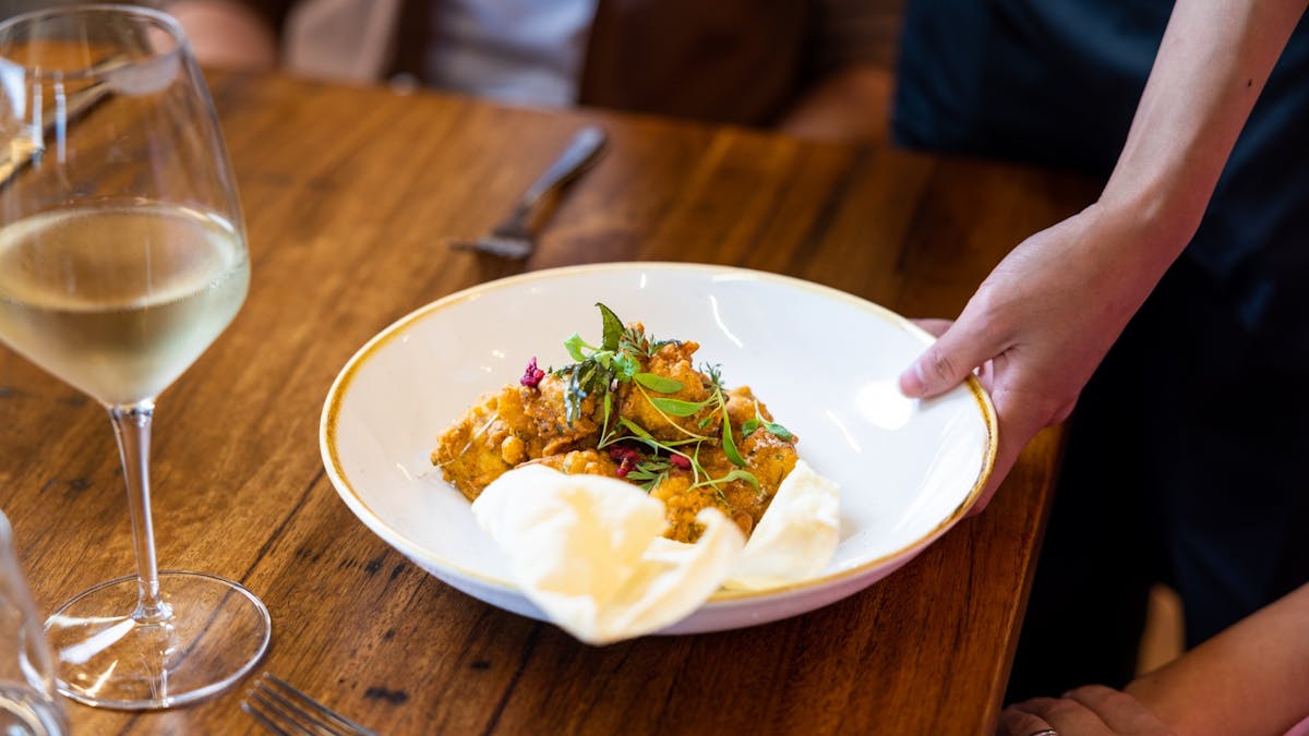 Plated food being served