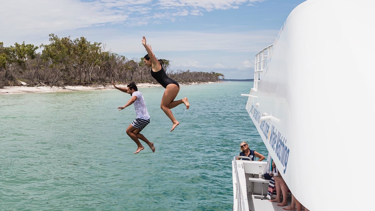 Whalesong Cruises K'gari Fraser Island West Coast Beach + BBQ cruise jumping off boat