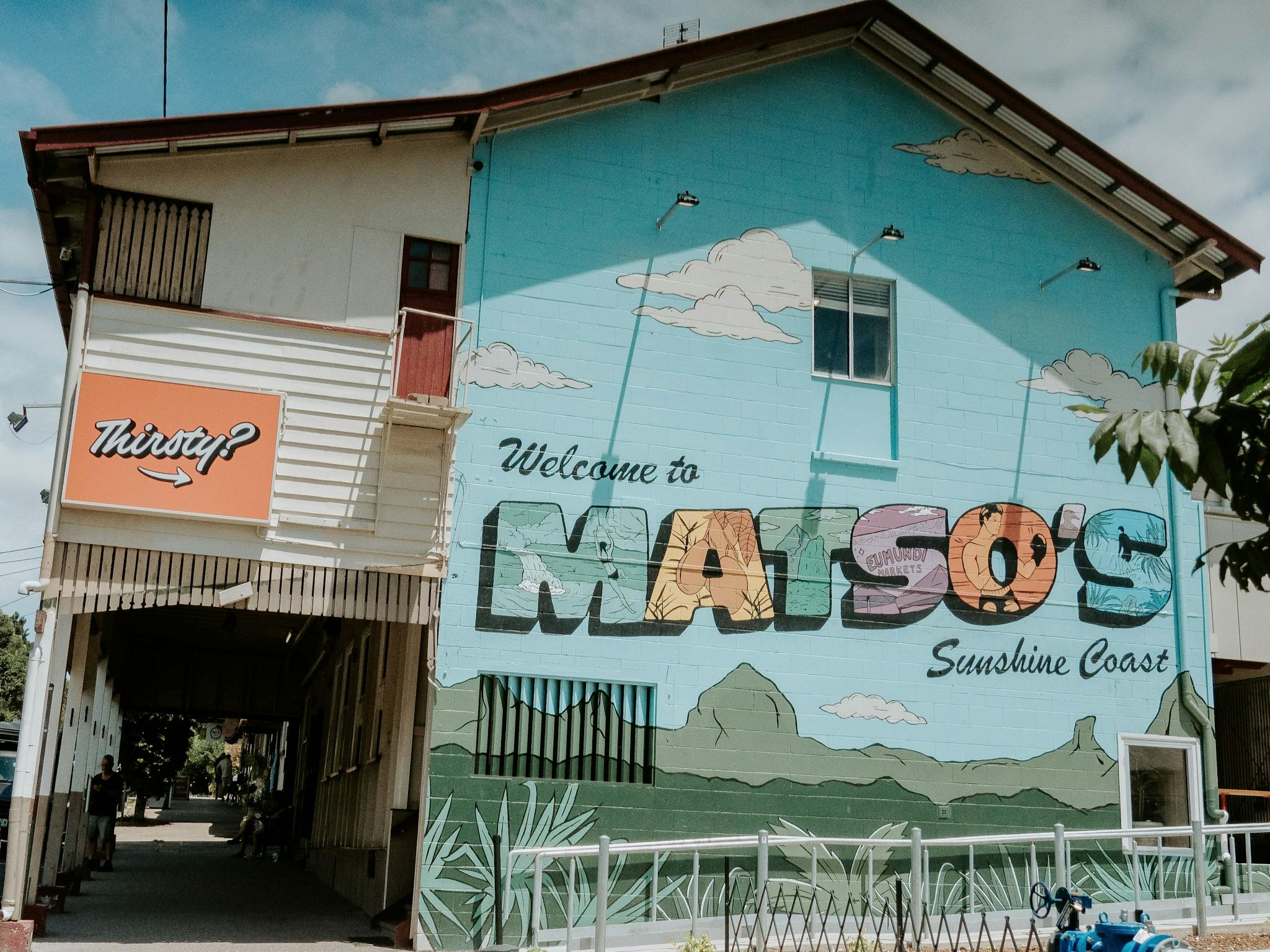 Matso's Sunshine Coast entrance mural on the side of the building Matso's Sunshine Coast entrance mural on the side of the building