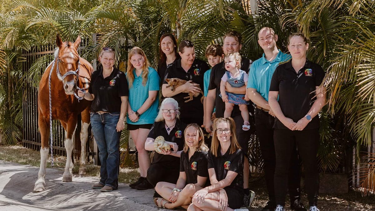team photo showing some of the animals used in therapy- horse, snake, dog