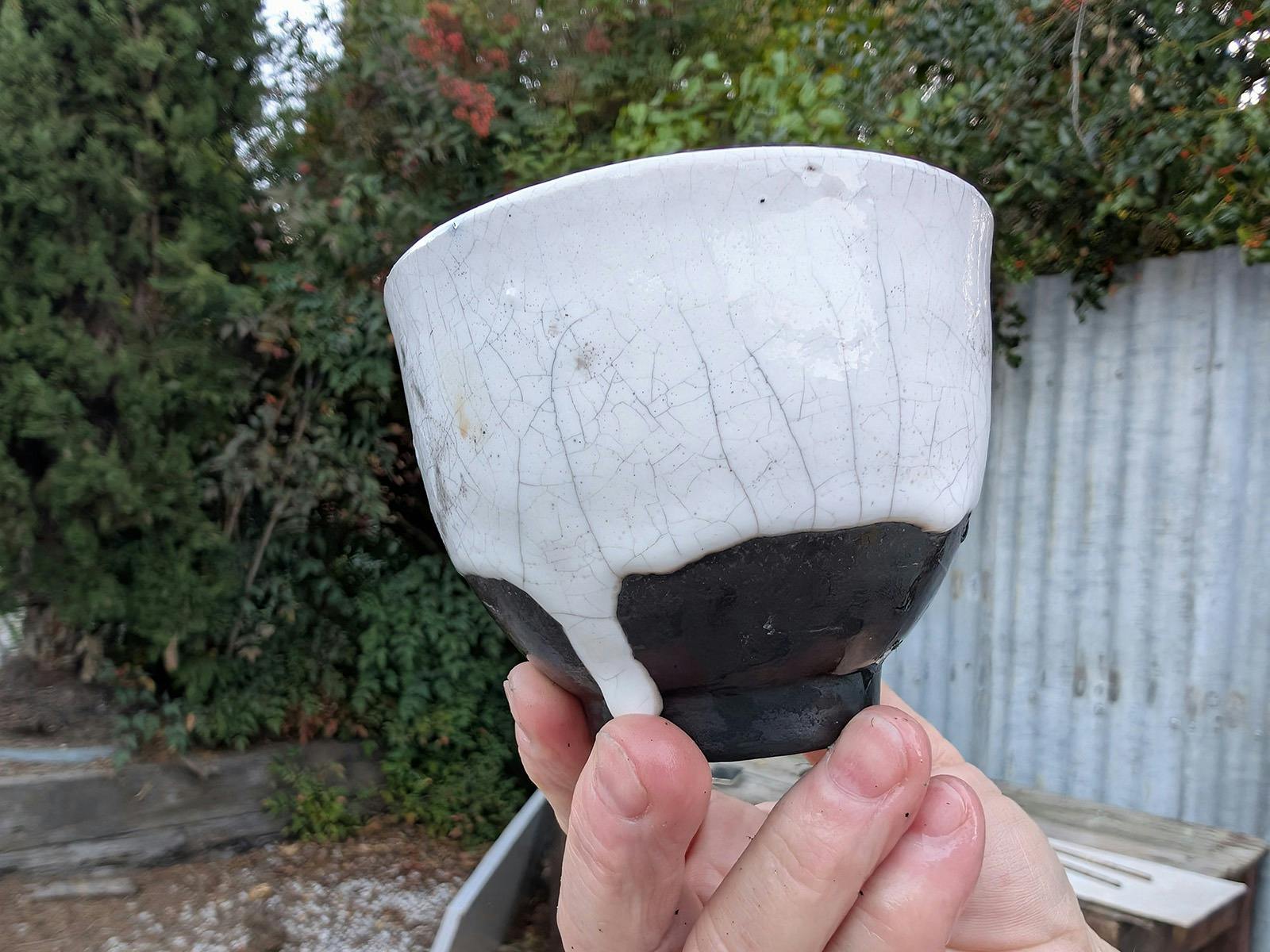 A black and white Raku pot