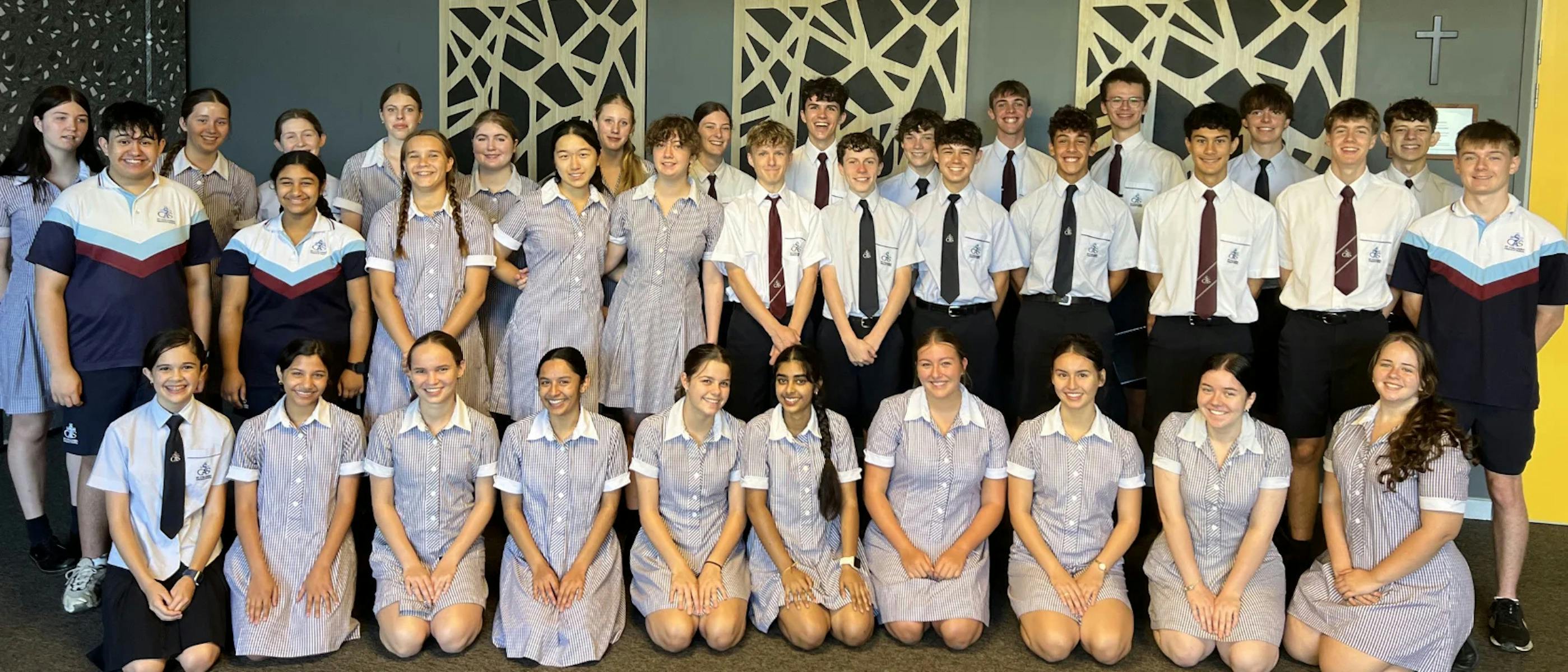 A choir of school children smiling