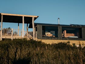 The train carriage exterior in the late afternoon sun