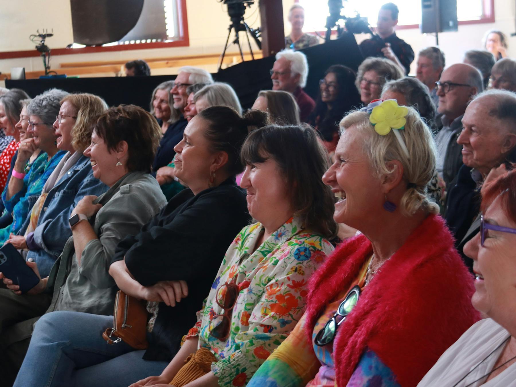 Audience laughing and entertained by authors talking about their books at the festival