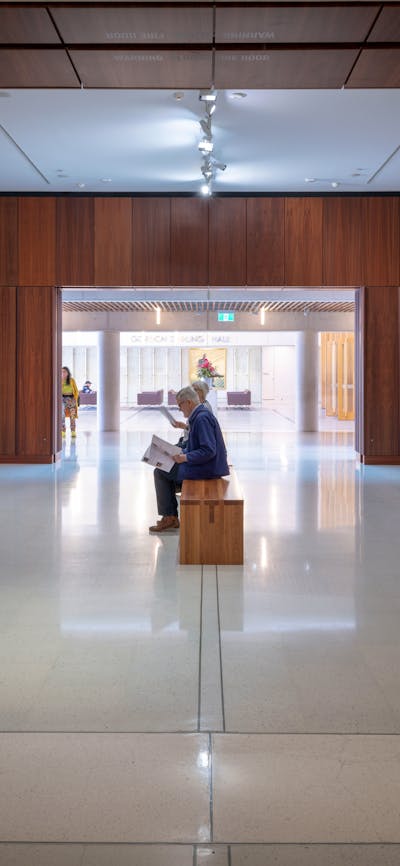 A photograph of Gallery 1 space featuring a salon hang of paintings