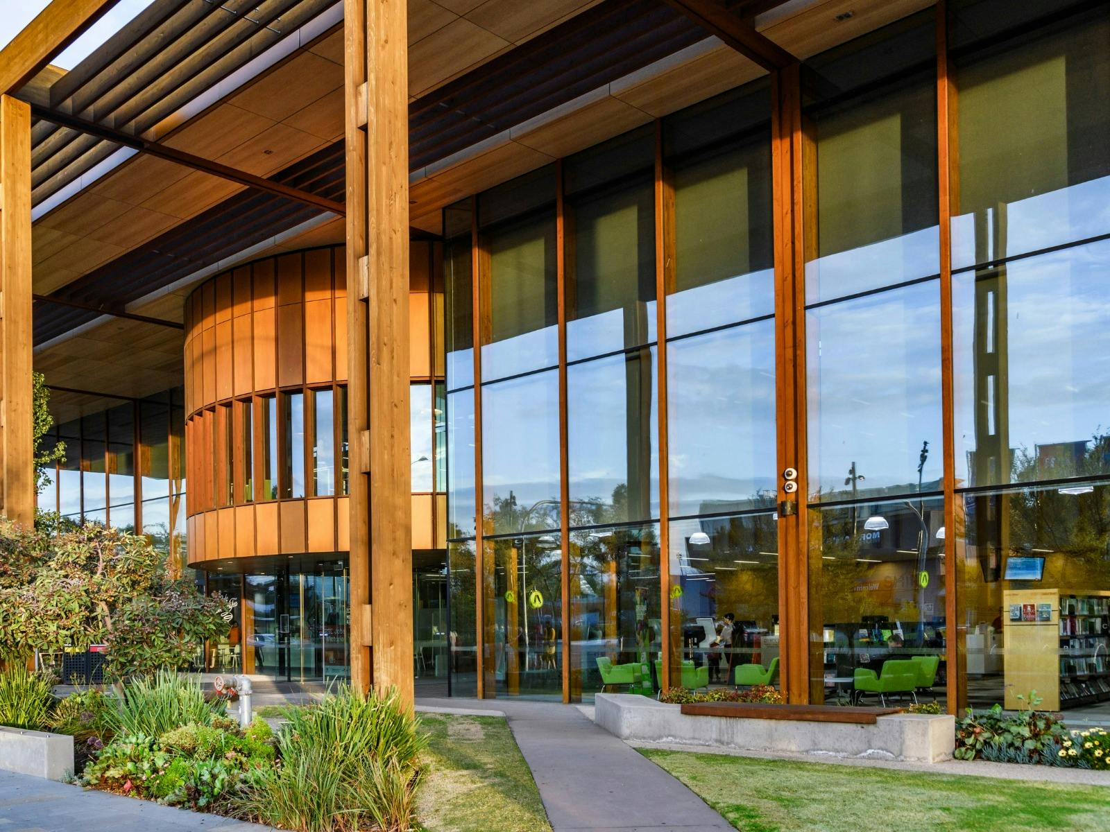Outside Melton library from a different angle. Facade is wood and glass windows