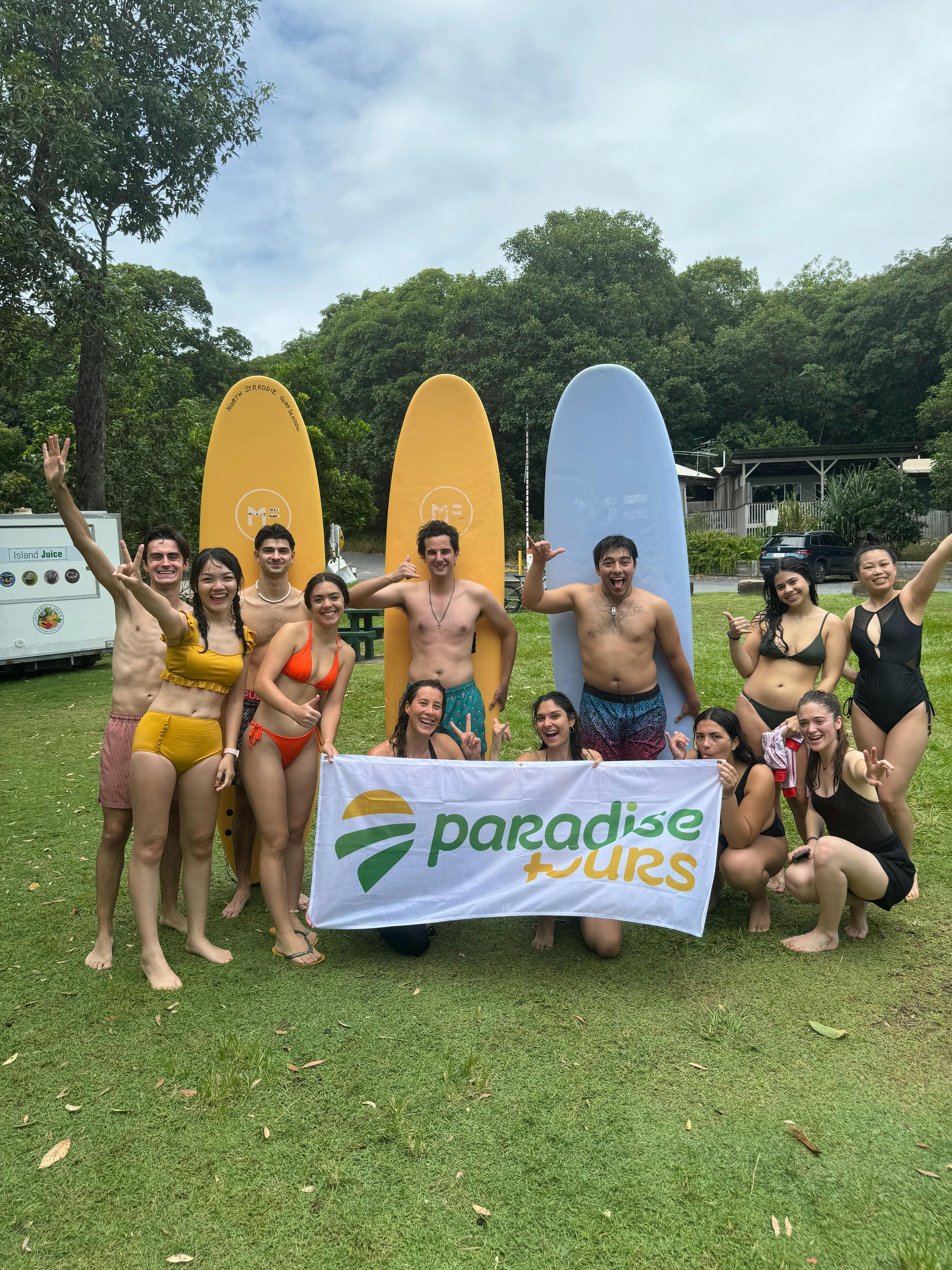 Paradise Tours group with surfboards