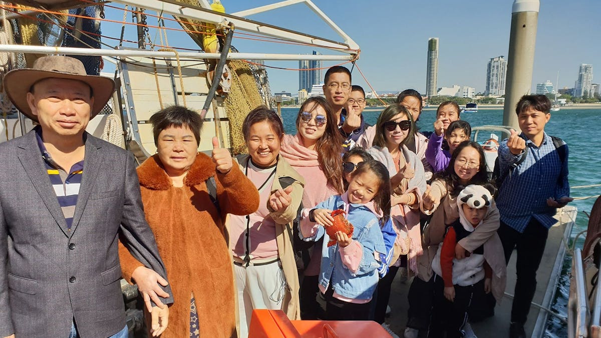 guests on boat smiling