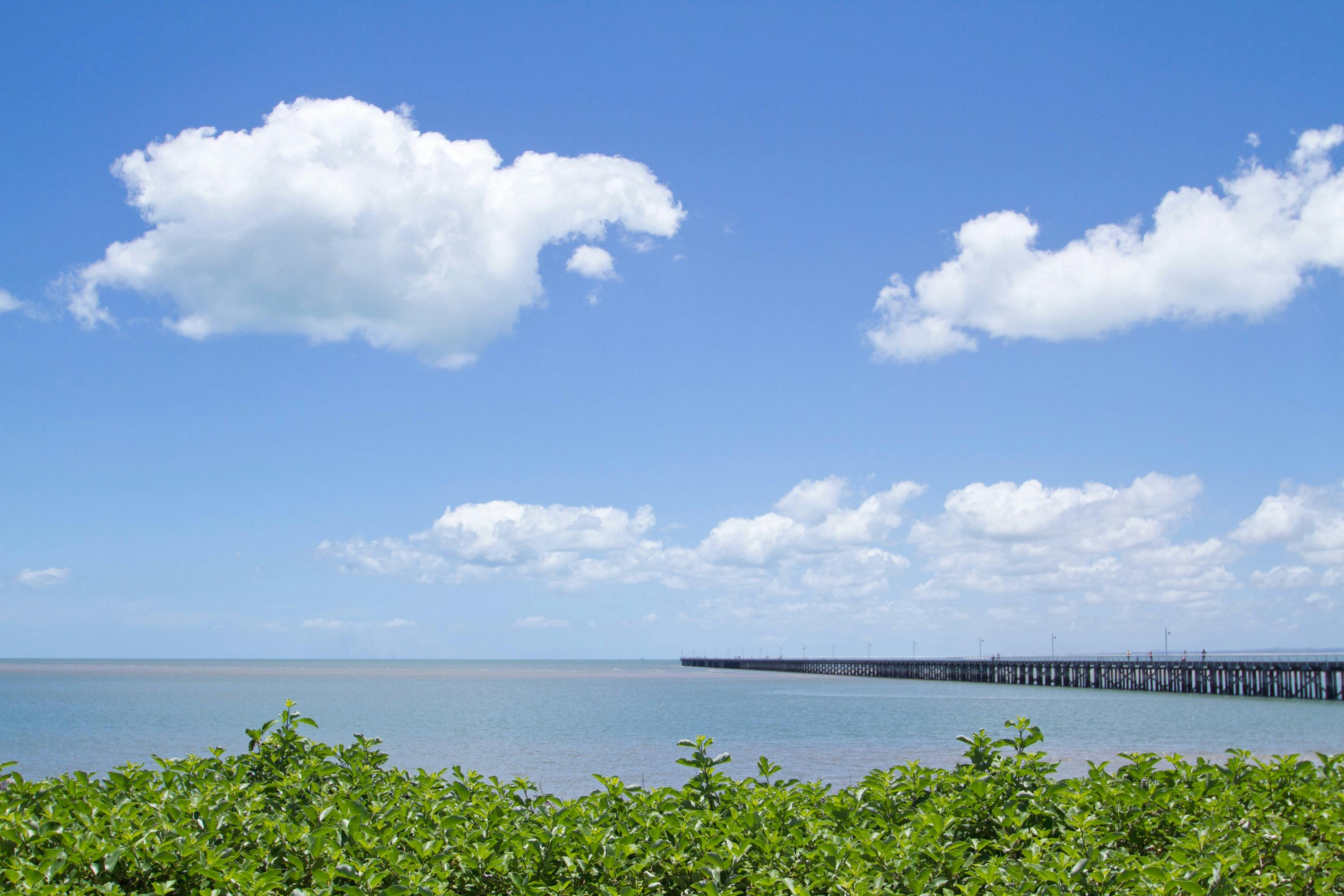 photo showing Urangan Pier running out into the bay from the shoreline