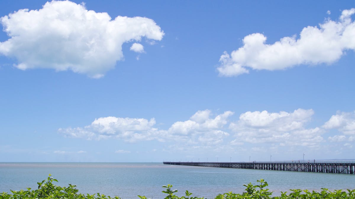 photo showing Urangan Pier running out into the bay from the shoreline