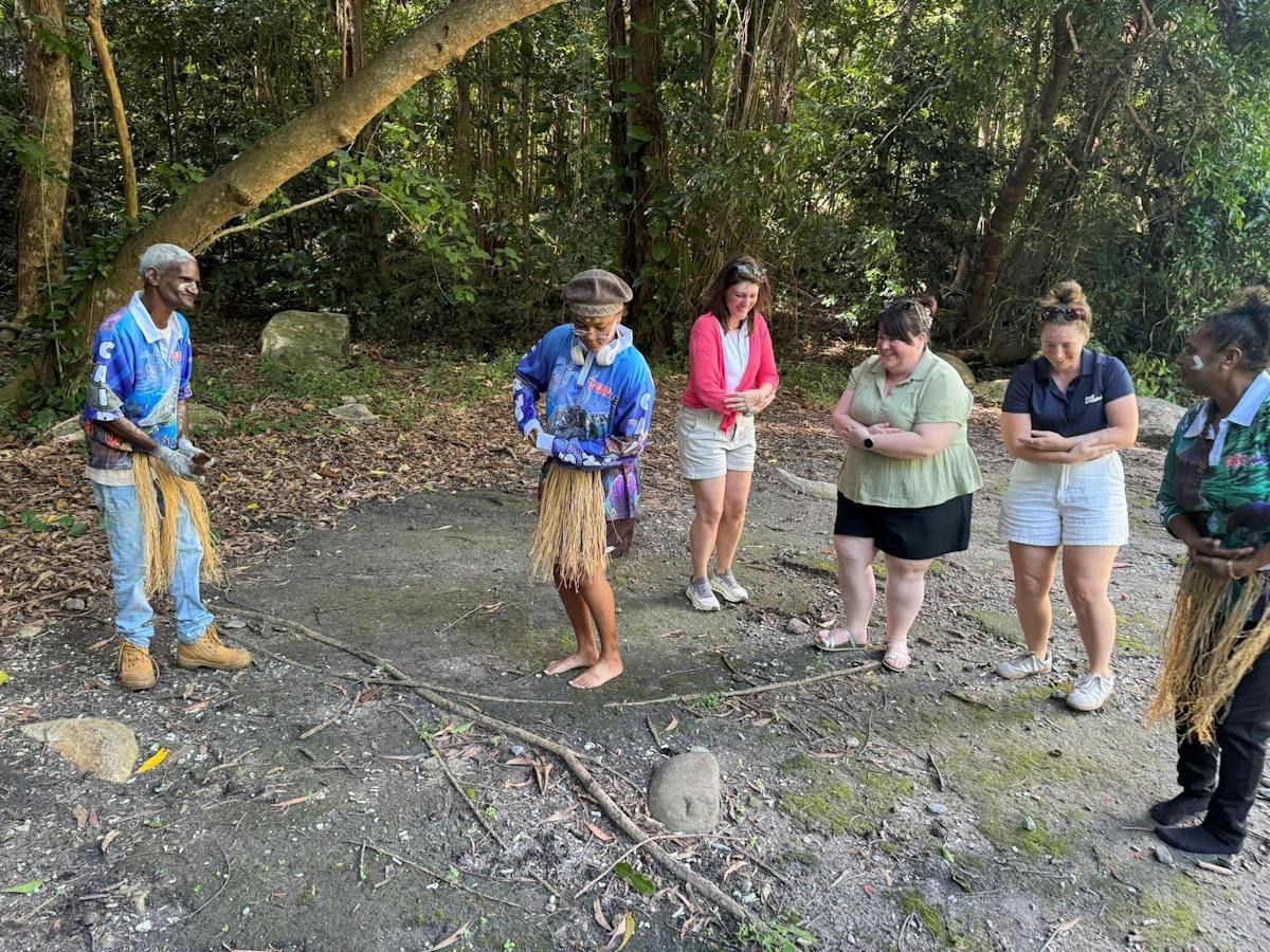 Visitors taking part in a Gunggandji cultural experience on Kumbrra