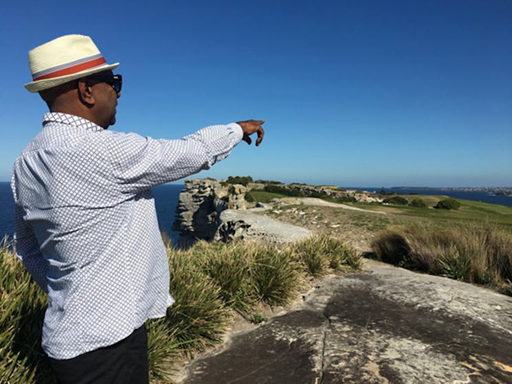 Walangari points out places of interesting on his Bondi Aboriginal Walking Tour.