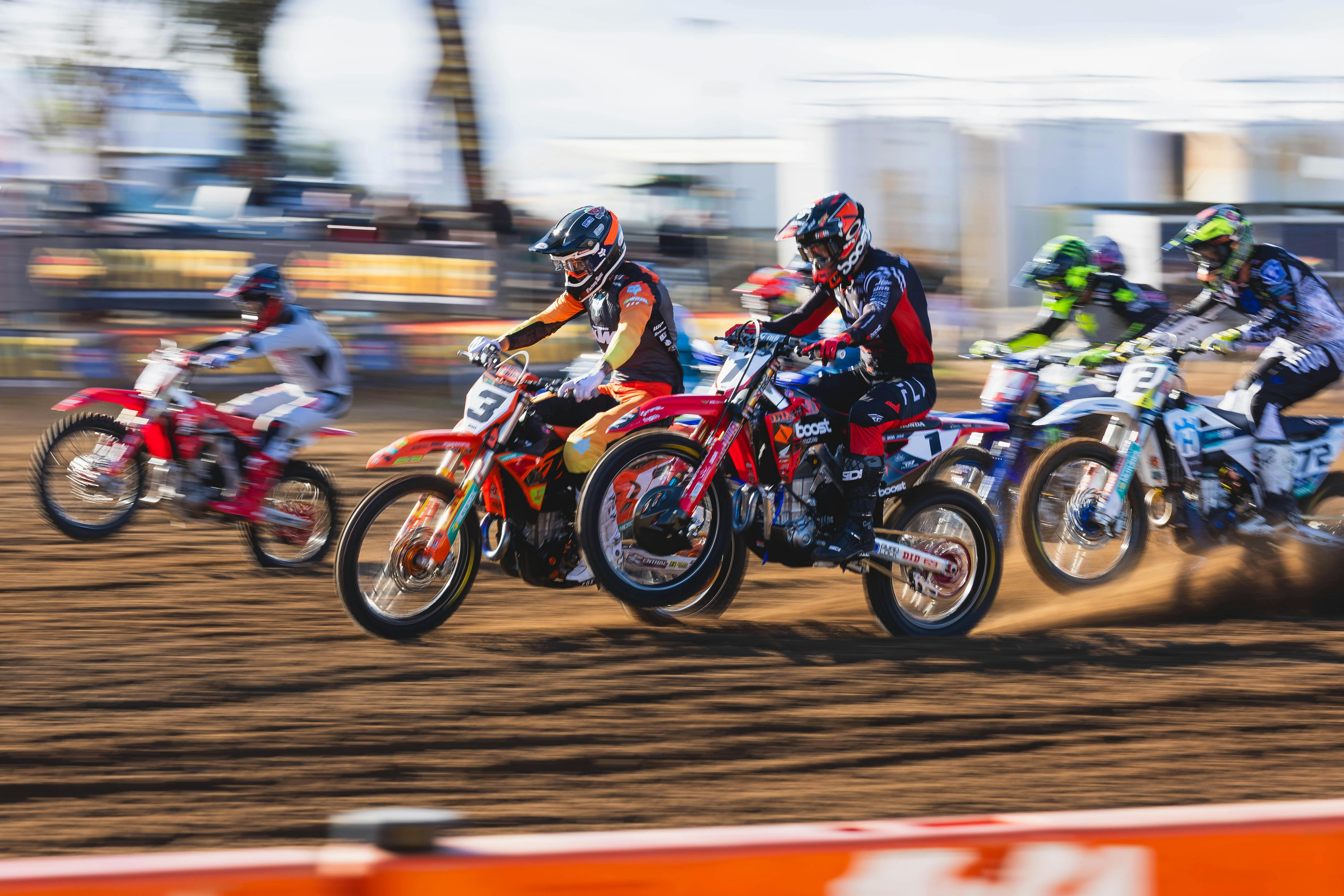 Riders race off the MX1 start line
