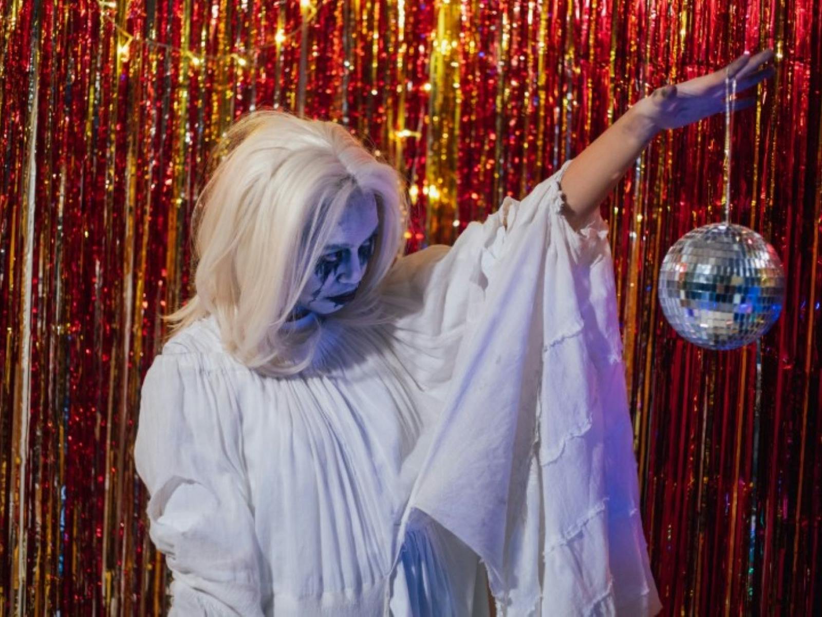 Image of a girl dressed up as a ghost at the disco