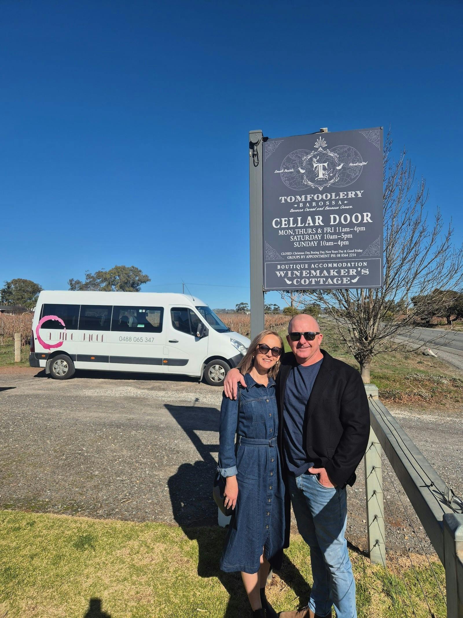 Two people standing in front of a winery