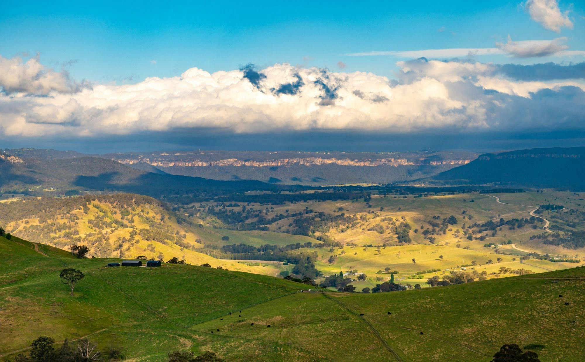 Clouds and glorious golden sunlight over the green serenity of the majestic Kanimbla Valley.