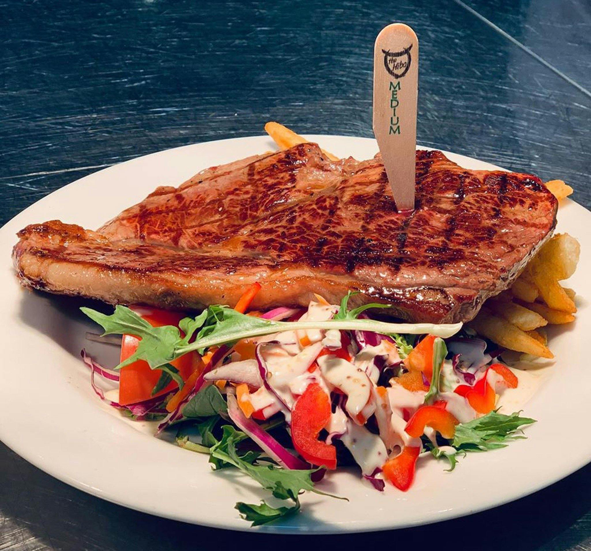 Steak on a plate with salad
