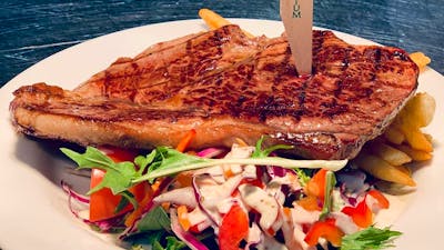 Steak on a plate with salad
