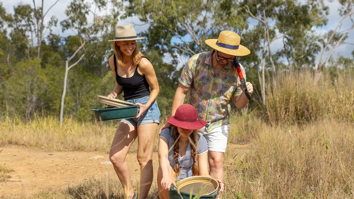 Young travellers fossicking for gold at Mount Morgan No 7 Dam