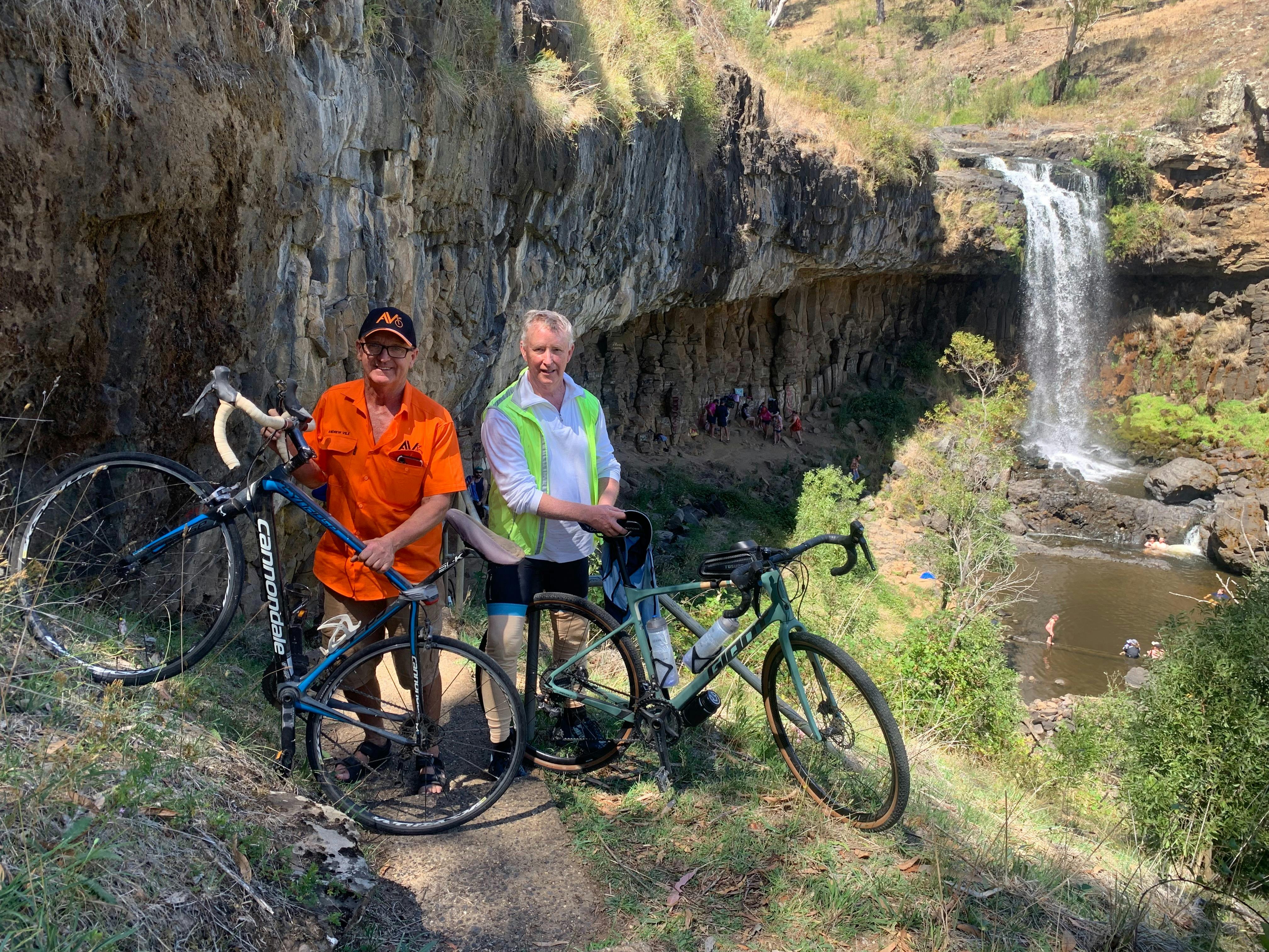 cyclists at waterfalls