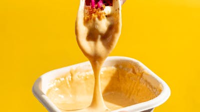 Tacos dipped in our house nachos cheese sauce