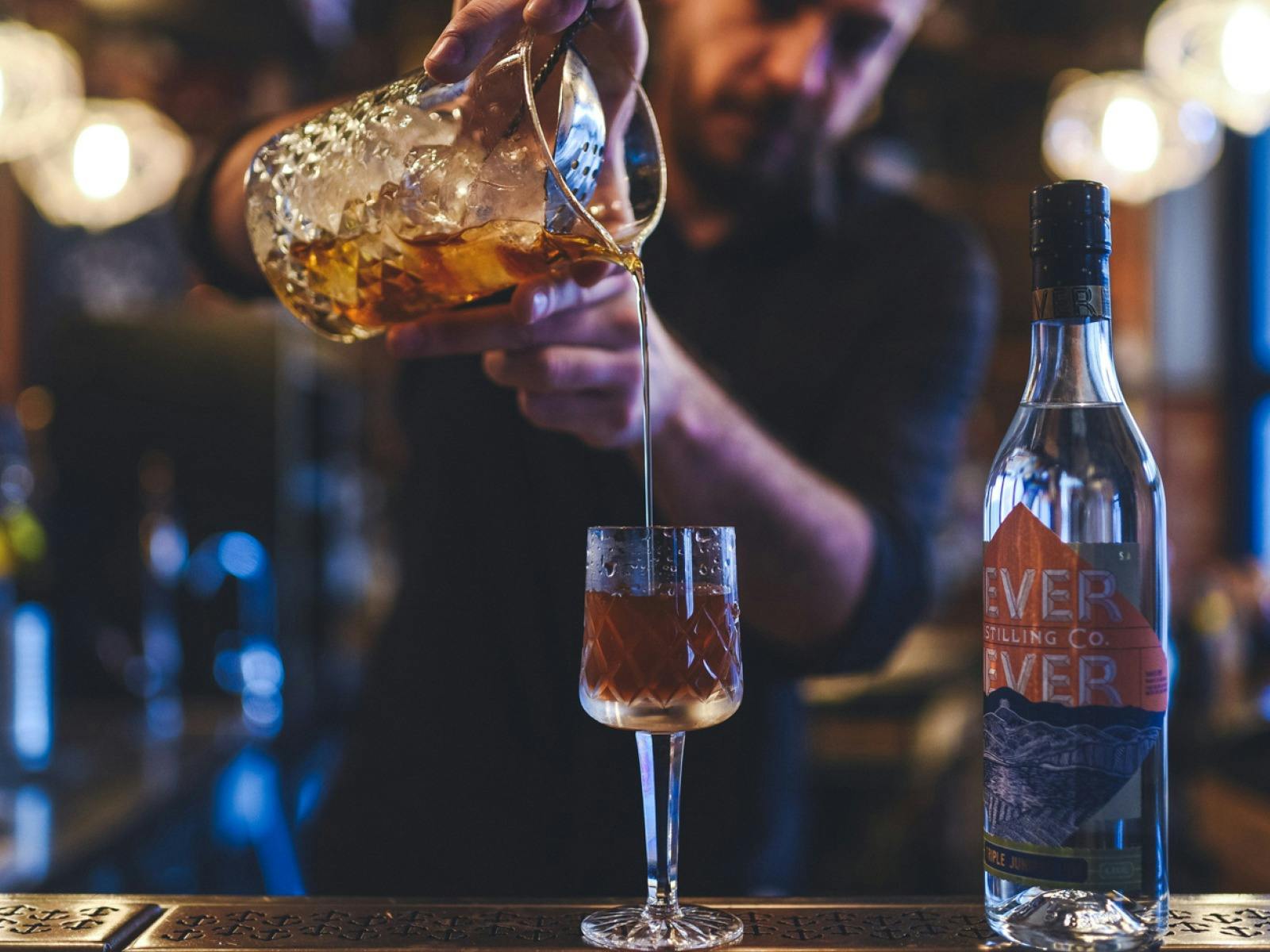 Bar tender pouring a gin
