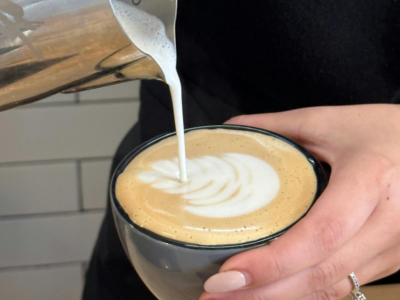 Barista pouring a coffee