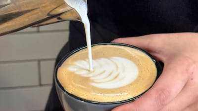 Barista pouring a coffee
