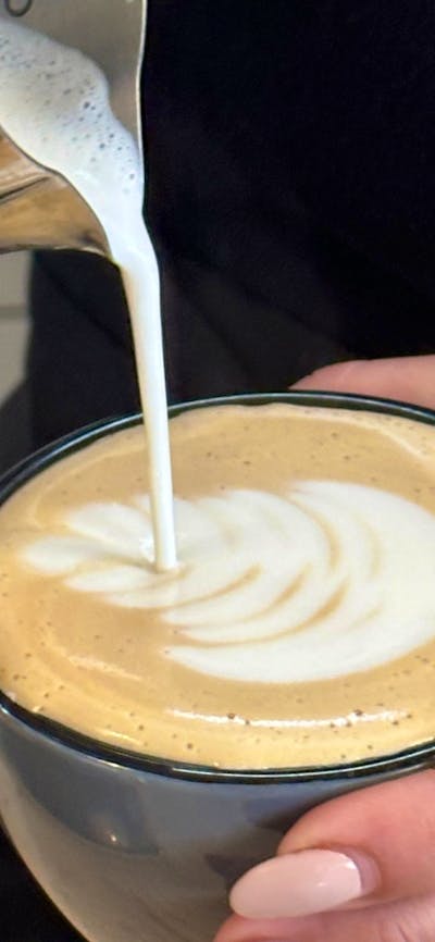Barista pouring a coffee