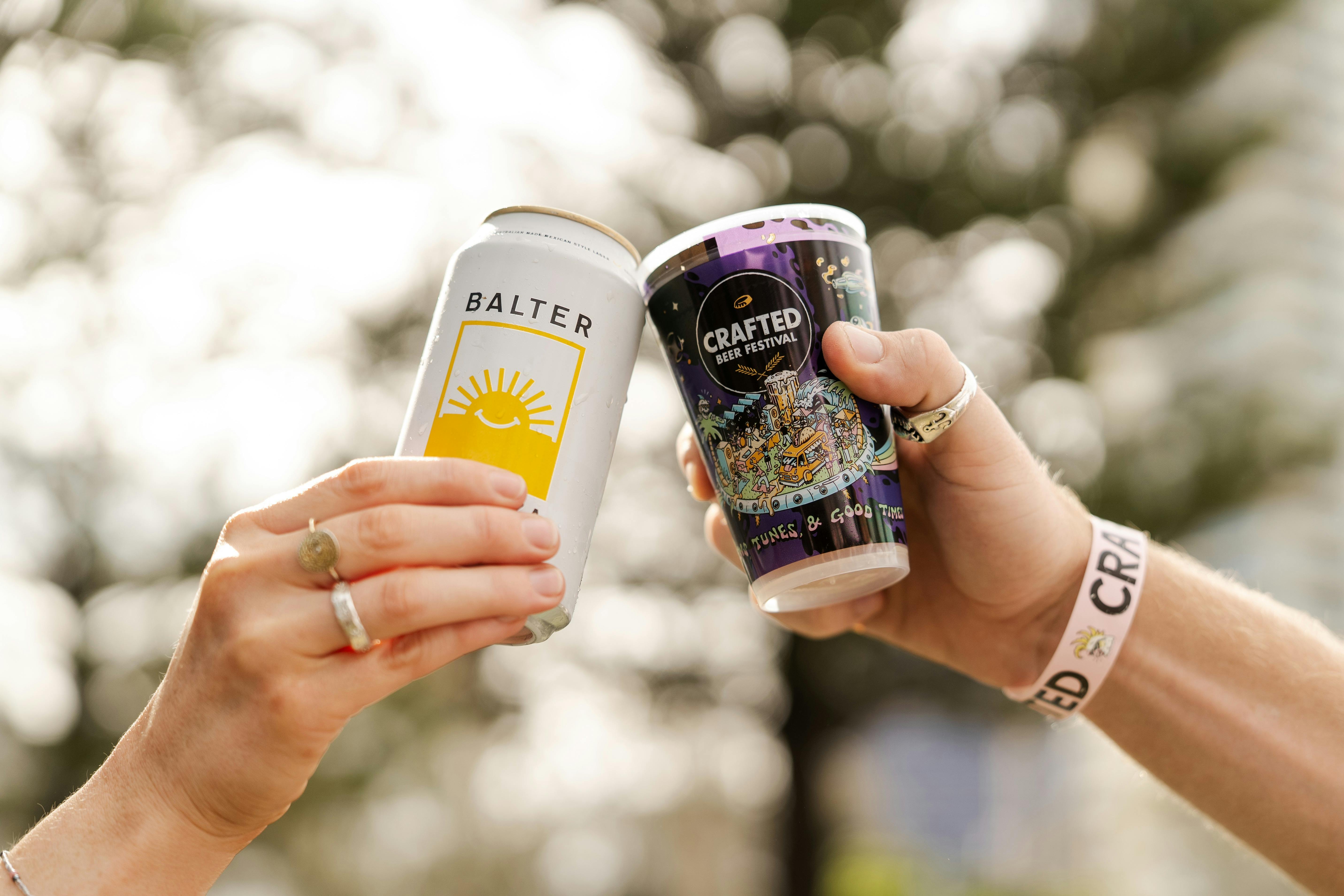 Two drinks being cheersed