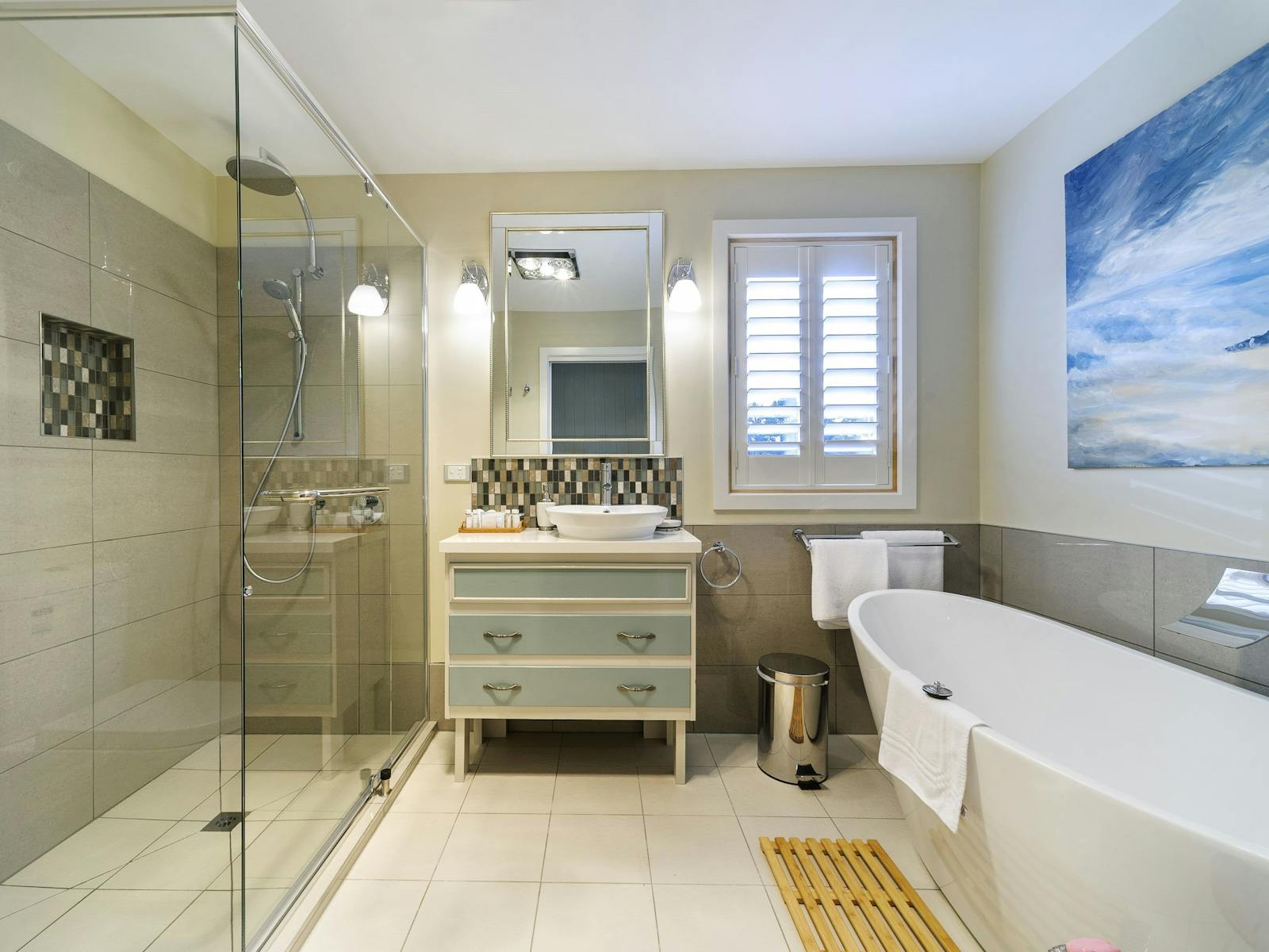 Bathroom with large deep set bathand large walk in shower.