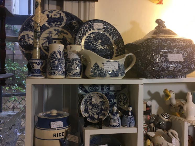 Shelves containing blue and white china