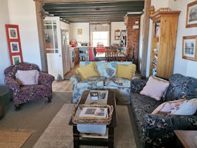 Cosy lounge room and kitchen at Gladstone Country Retreat