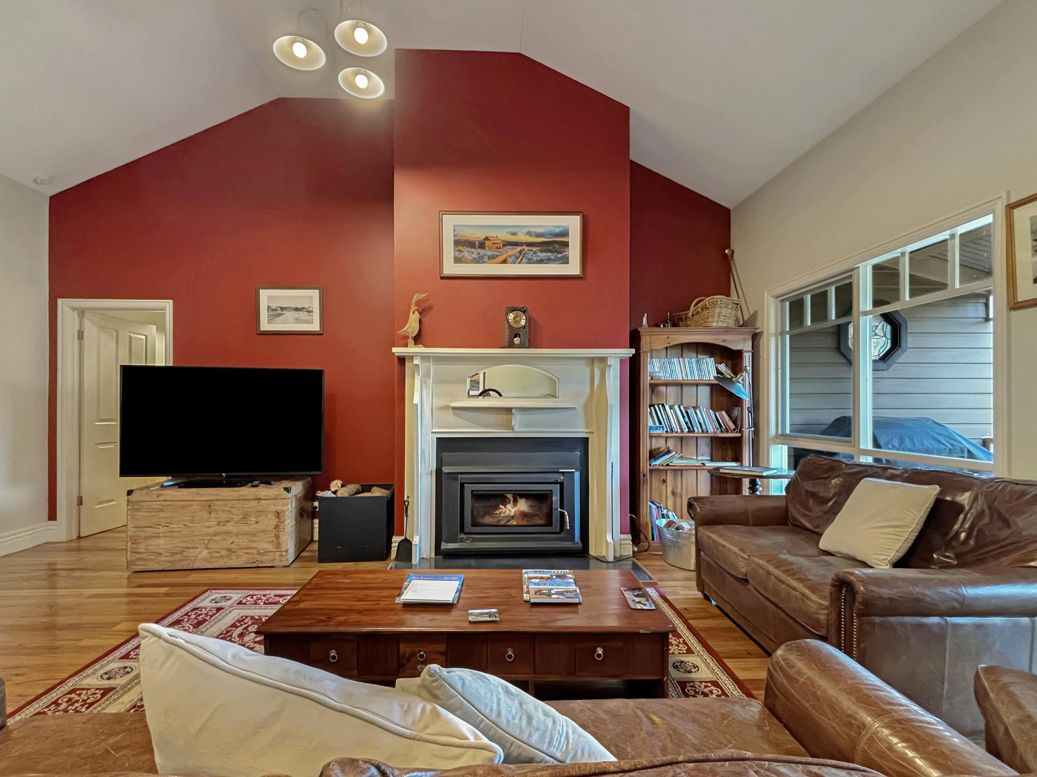 Lounge area with couches, television and fireplace at Rosedale House Mansfield